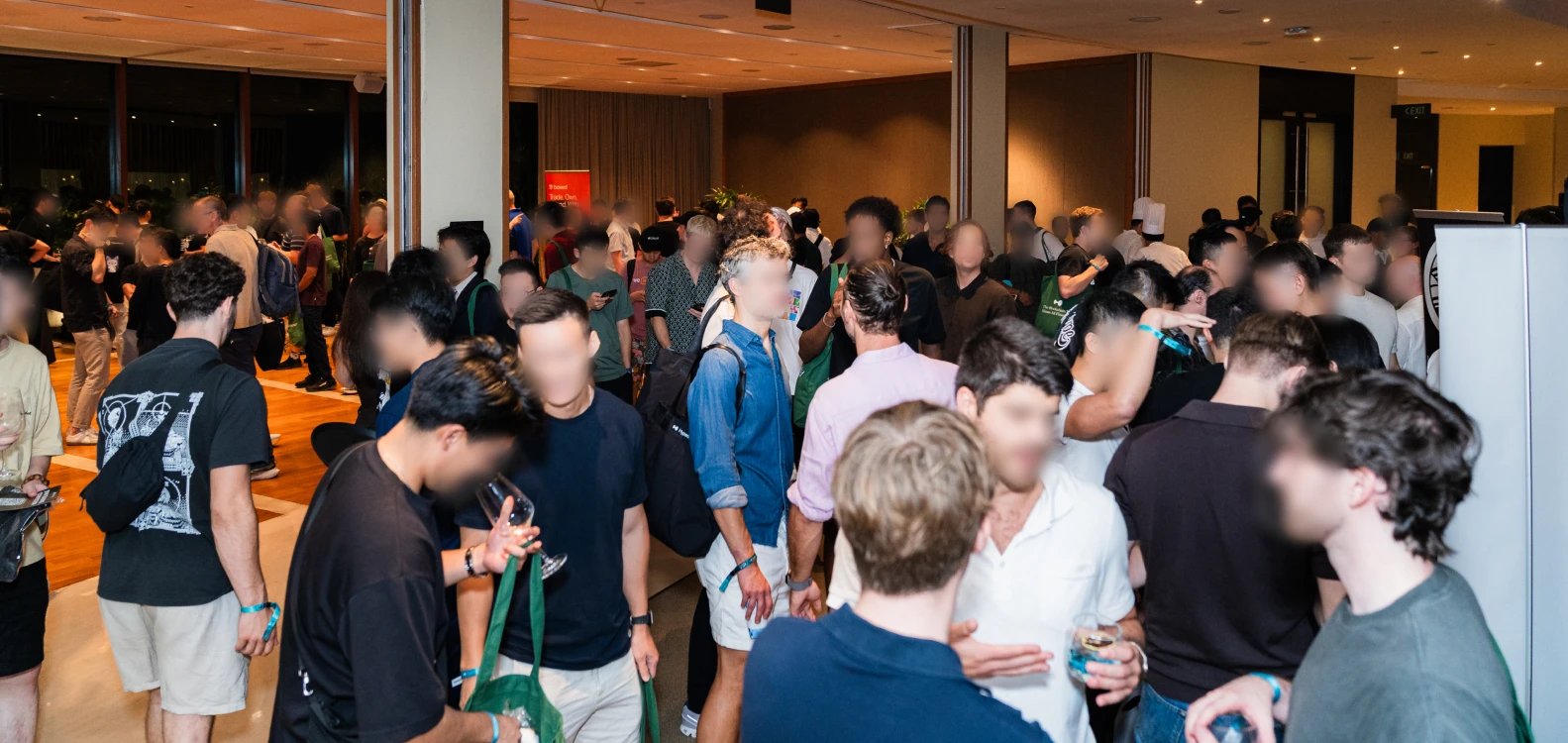 Crowd of attendees networking at a Hyperliquid event